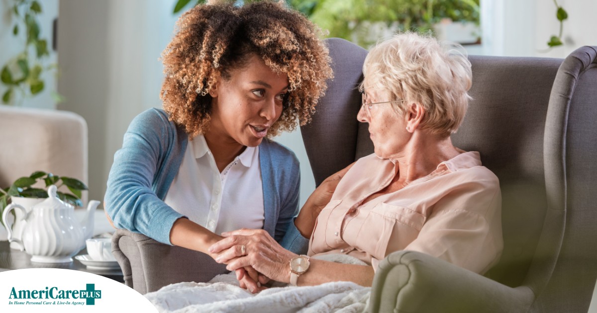 A caregiver warmly reassures an older client, showing the kind of attitude that can help clients get used to new care arrangements.