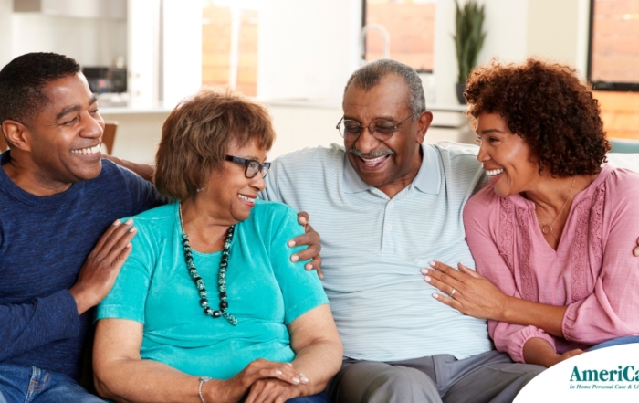 A couple sits with aging parents and enjoys their time together.