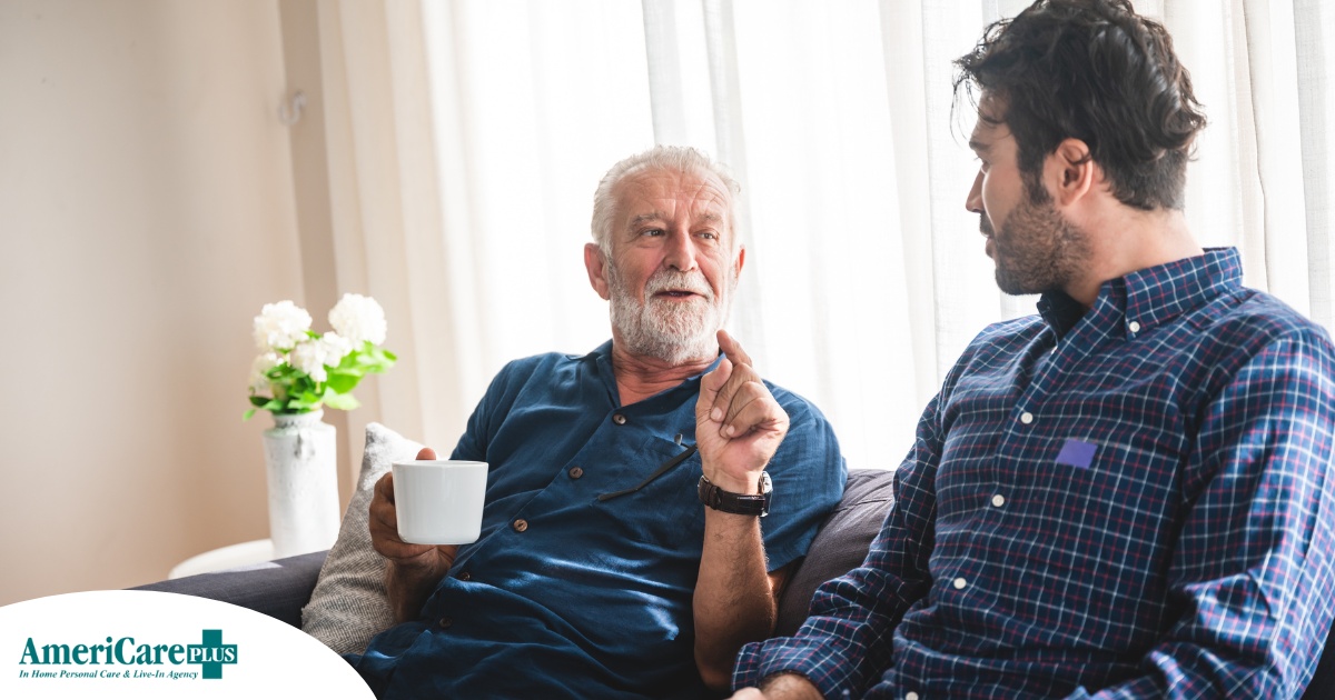 A son talks with an older parent representing the kind of communication needed to tell how aging parents are doing.