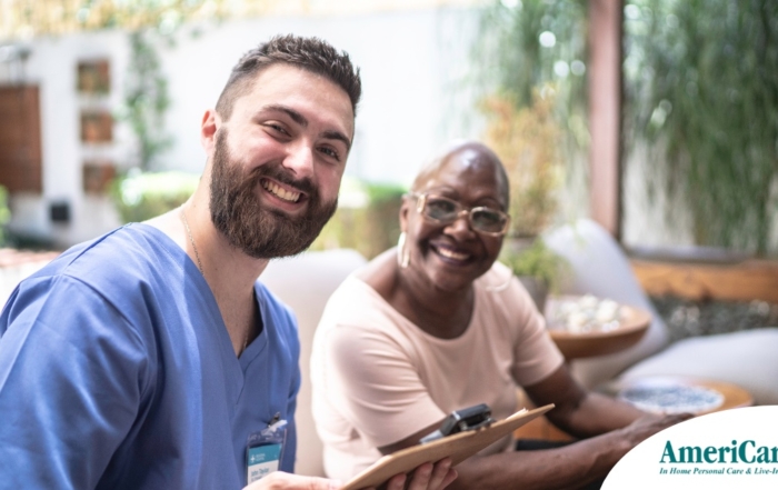 A caregiver and client smile showing that a career as a caregiver can be rewarding.